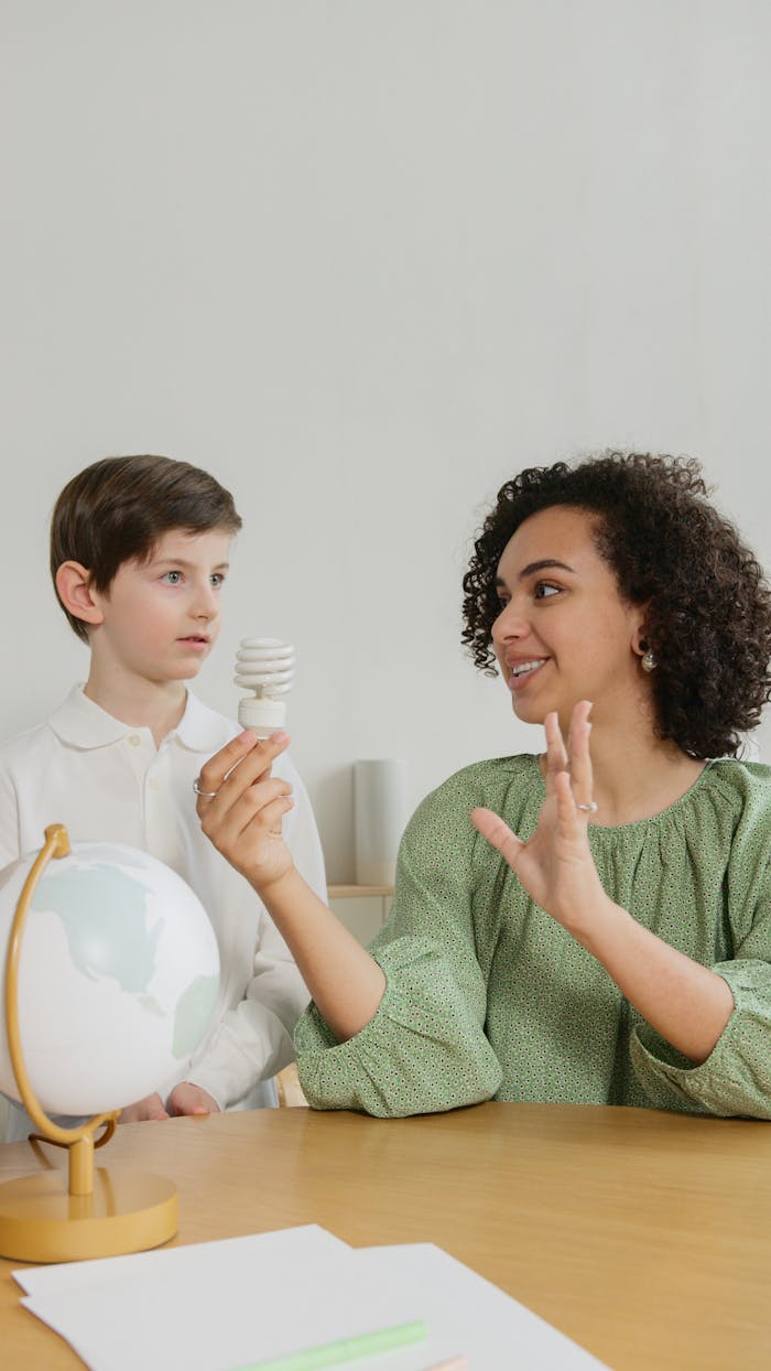 A teacher engaging with a student about environmental conservation and sustainability.